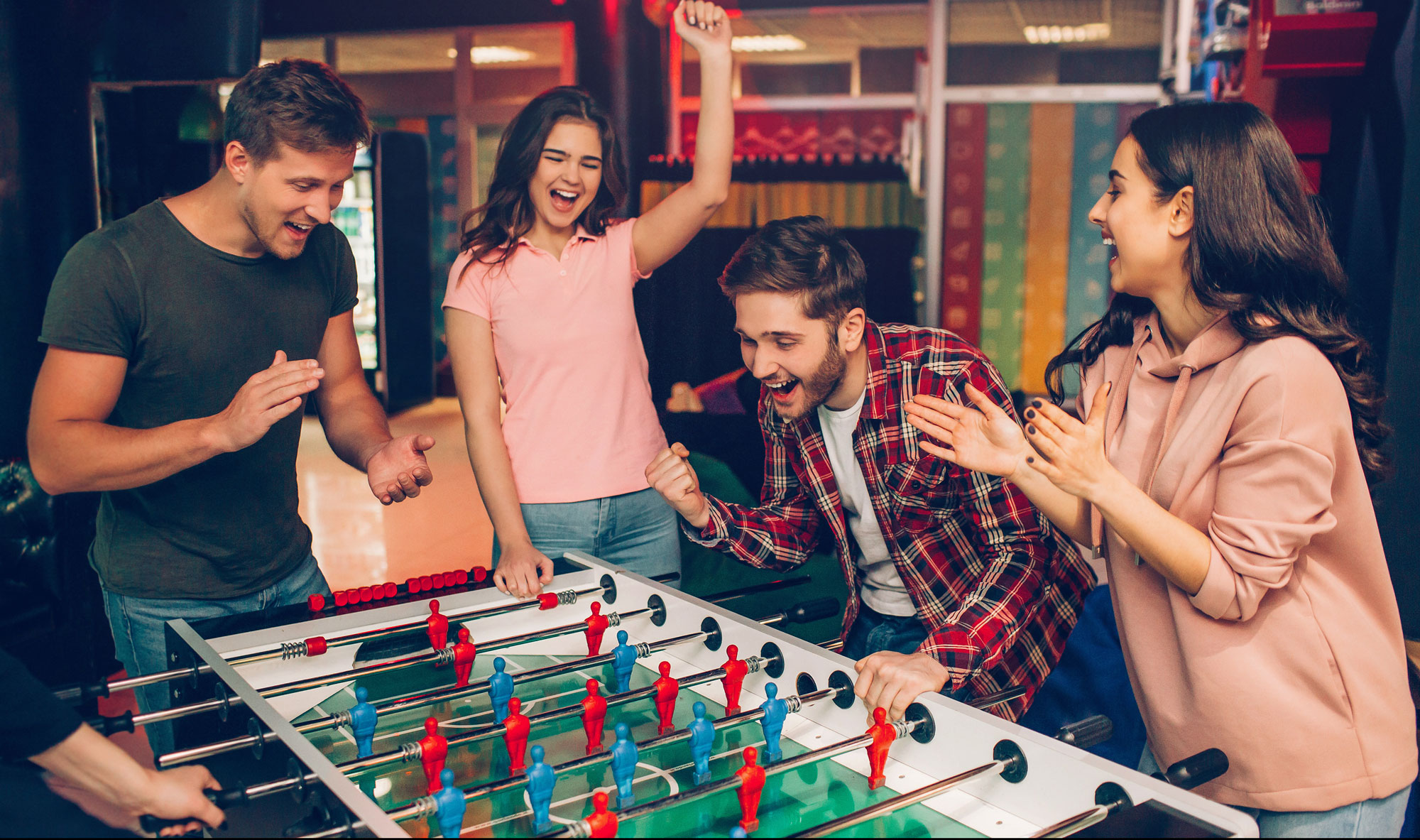 Friends playing table football