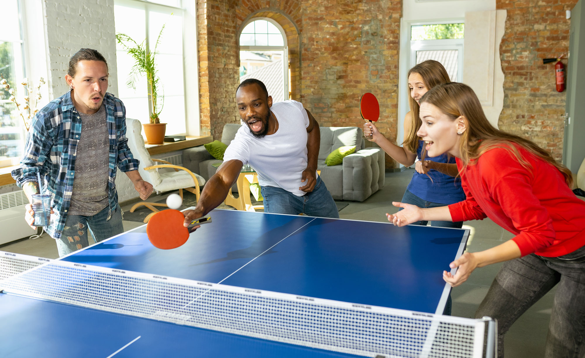 Friends playing table tennis