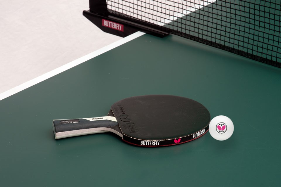 Table Tennis Bat on Table