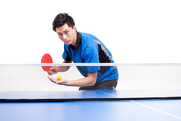 young table tennis player ready to serve