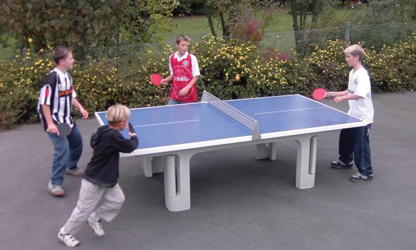 People Playing on a Butterfly Park Concrete Table Tennis Table