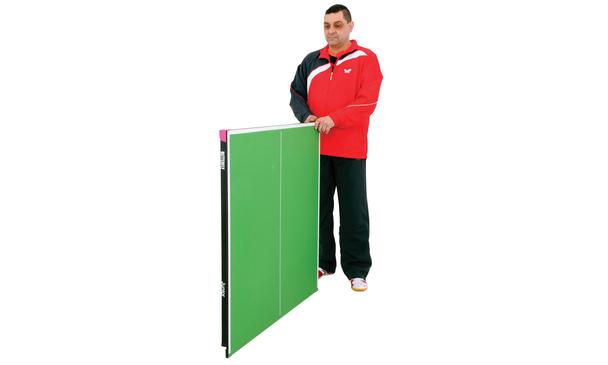 Butterfly Junior Indoor (3/4 size) Table Tennis Table Folded With Man Standing Beside It