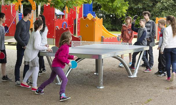Kids Playing on Cornilleau Park Table Tennis Table