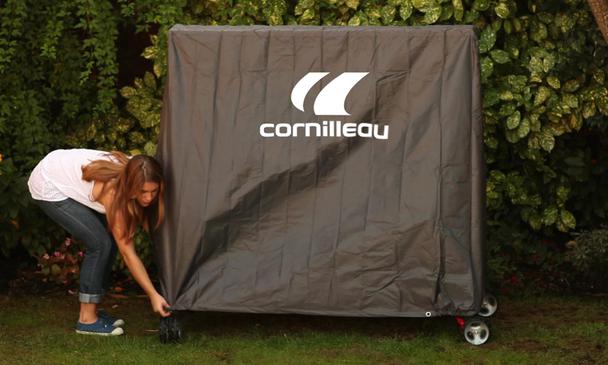 Lady Putting Cornilleau Polyester Premium Cover on Table Tennis Table
