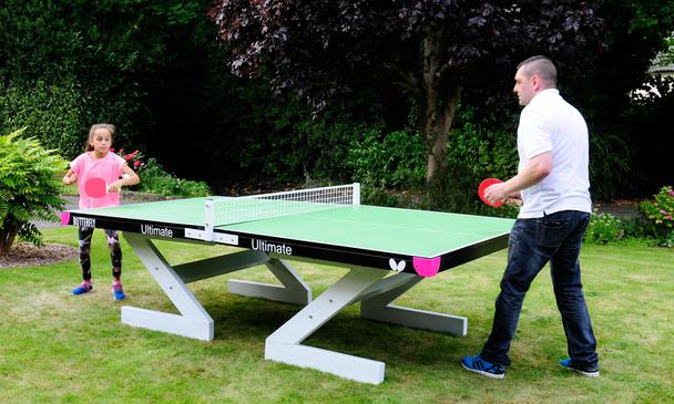 Butterfly Ultimate Green Outdoor Table Tennis Table With Parent and Kid Playing